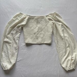 white puffy long sleeve top
